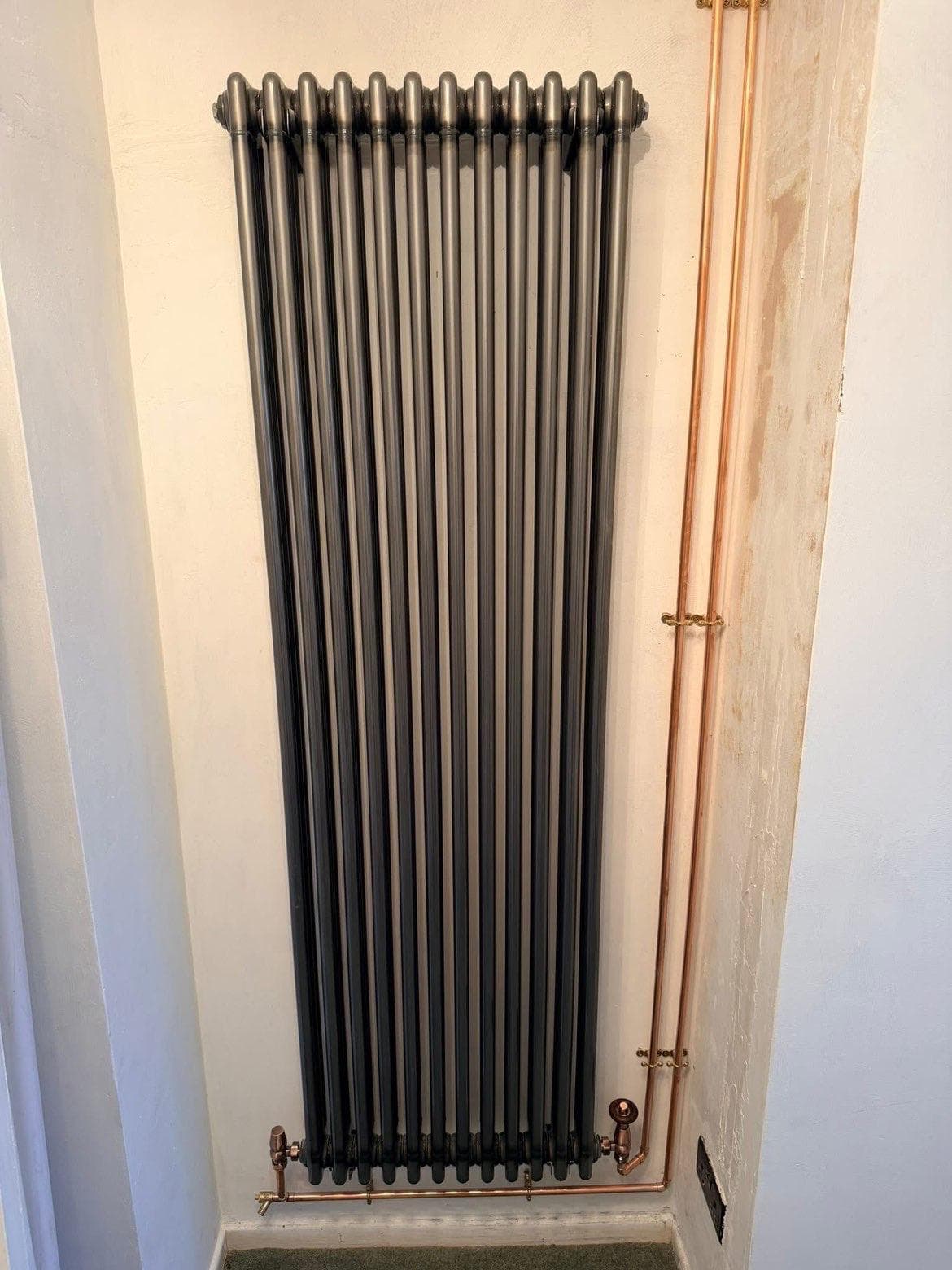 Wall-mounted pipework
